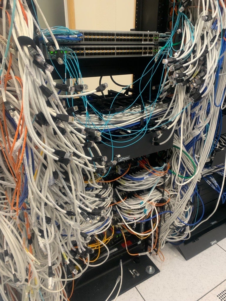  Photo: Disorganized cabling reduces visibility, serviceability, and available workspace. 