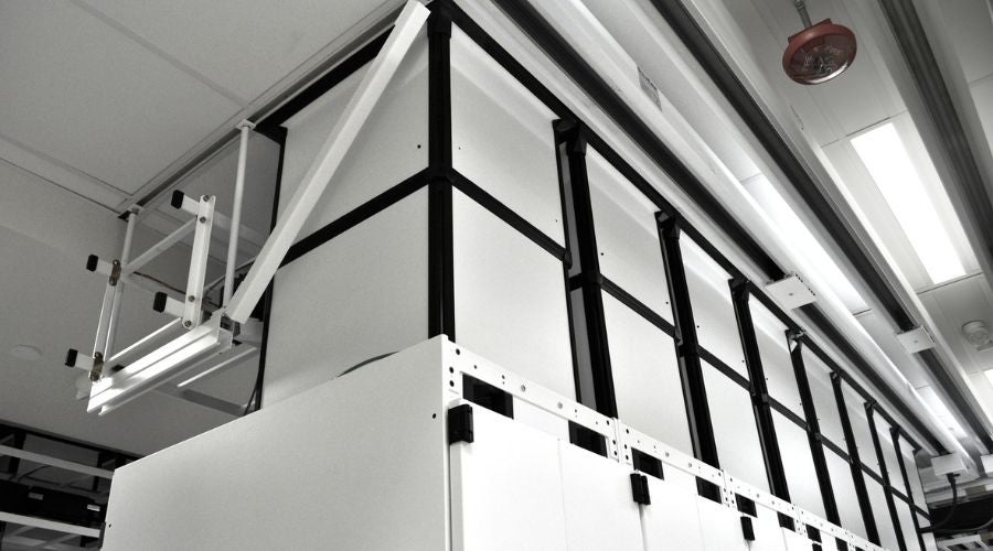 Vertical exhaust duct chimneys installed on data center cabinets to direct hot air into overhead return plenums.